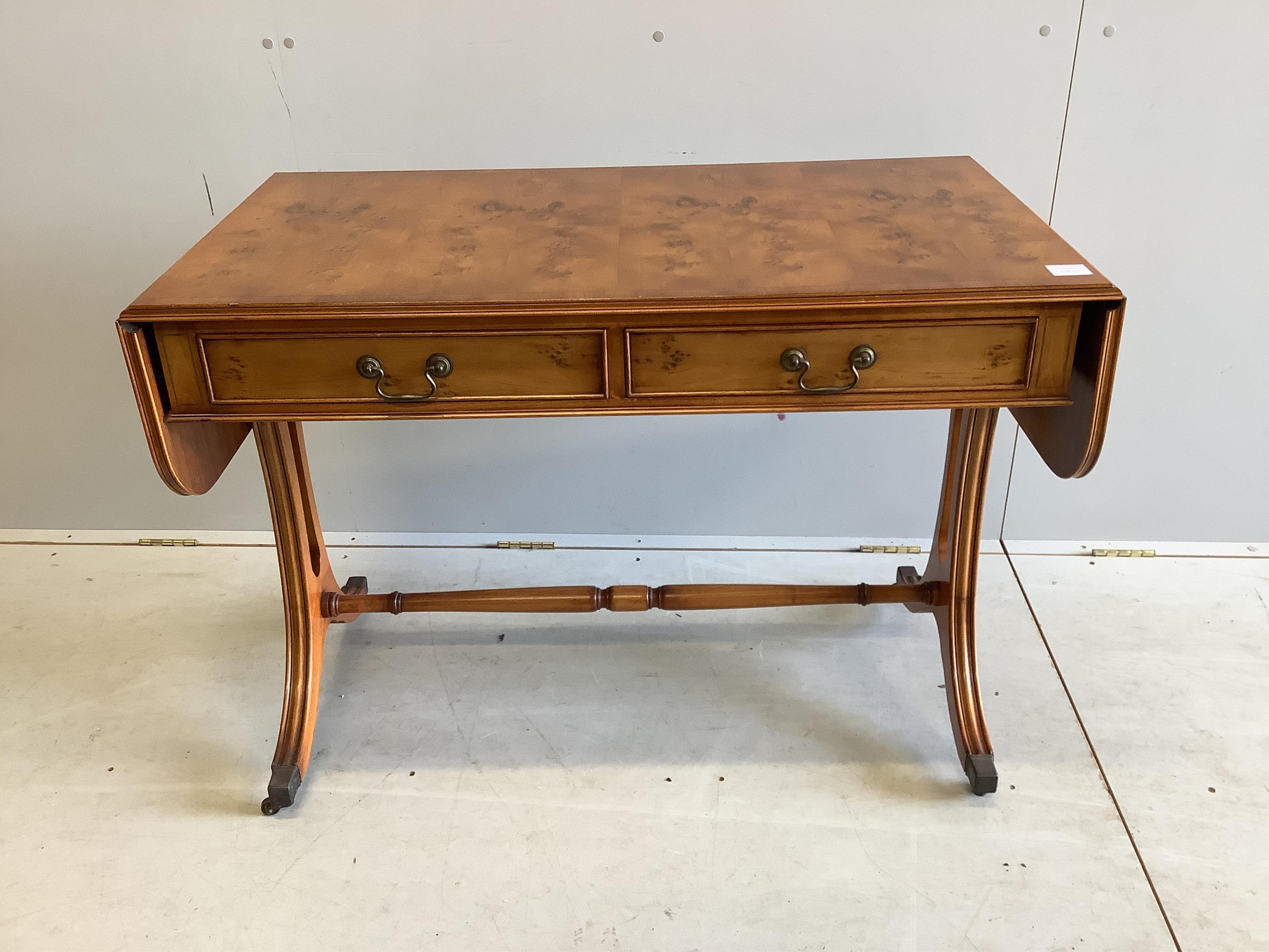A reproduction Regency style yew sofa table, width 104cm, depth 56cm, height 74cm. Condition - good